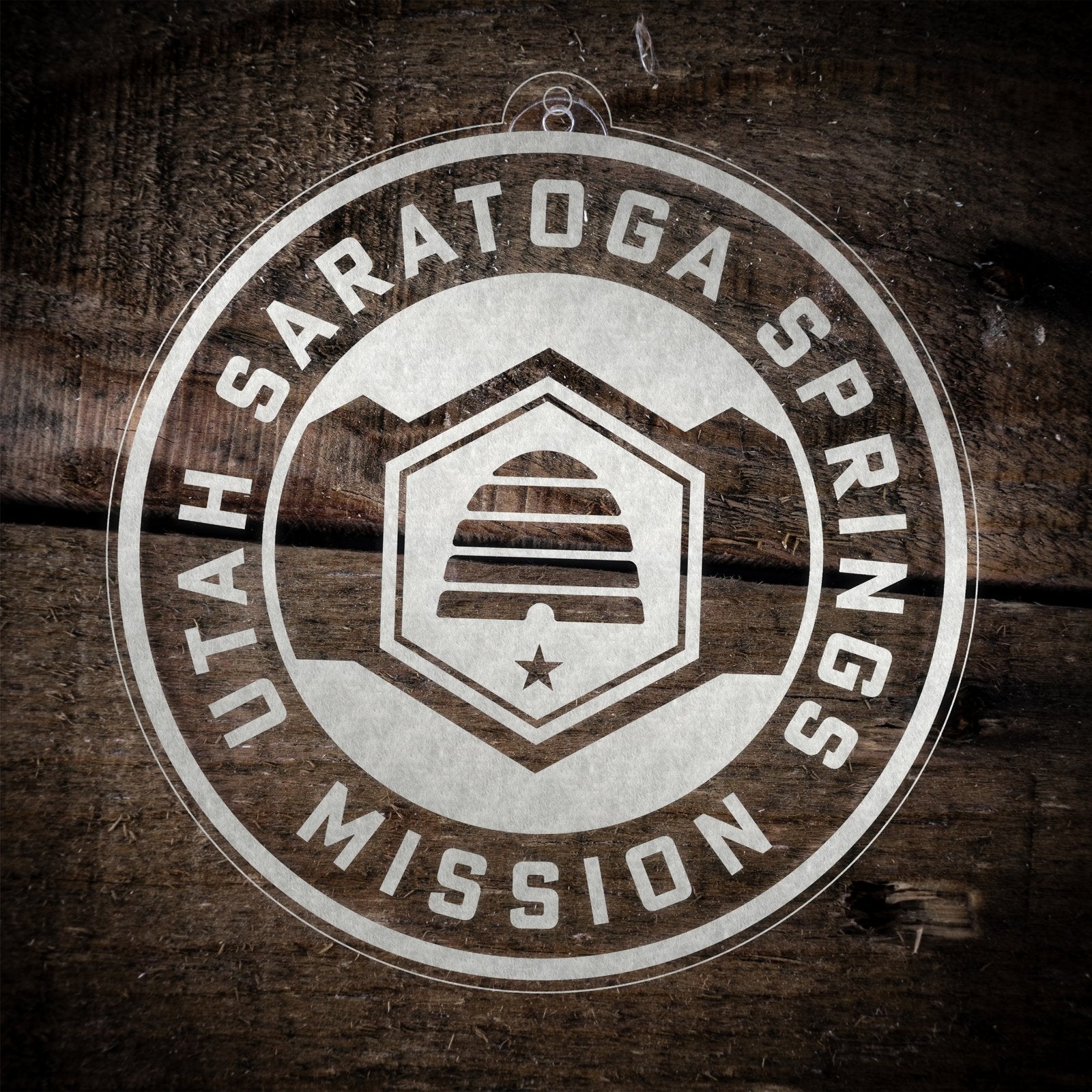 LDS Utah Saratoga Springs Mission Christmas Ornament laying on a Wooden Background