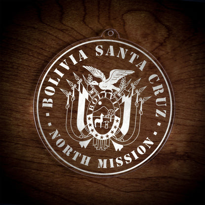 LDS Bolivia Santa Cruz North Mission Christmas Ornament laying on a Wooden Background