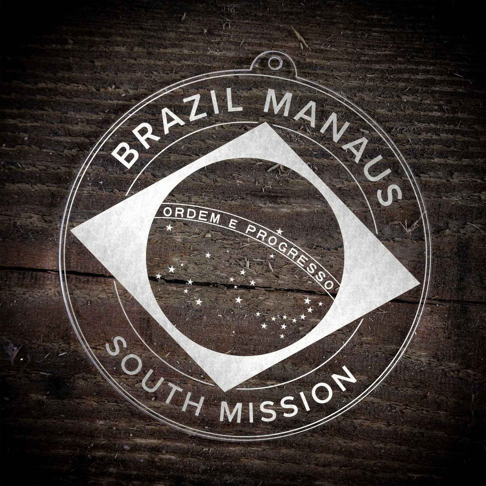 LDS Brazil Manaus South Mission Christmas Ornament laying on a Wooden Background