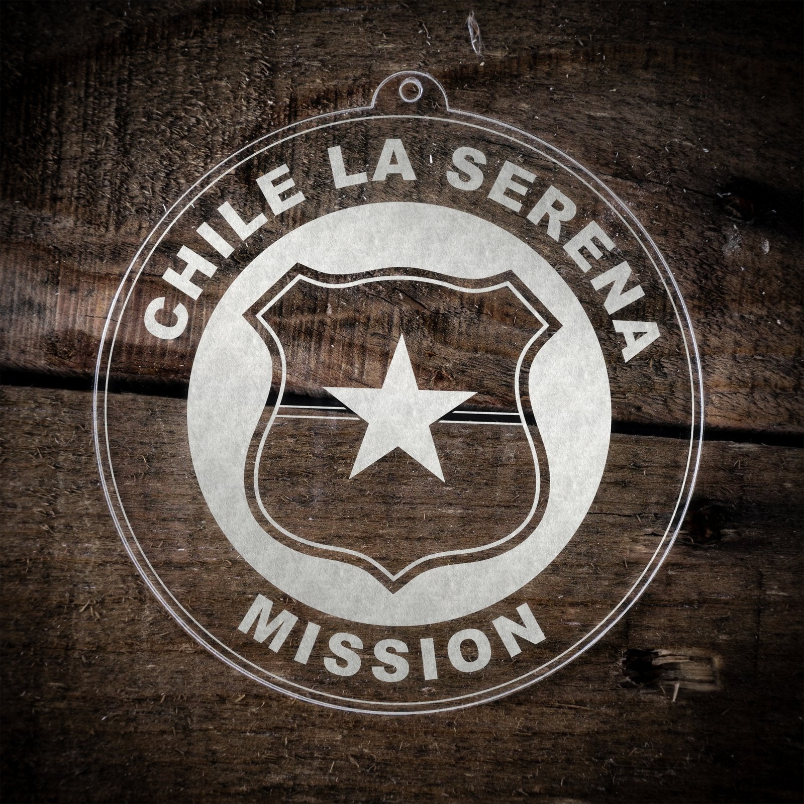 LDS Chile La Serena Mission Christmas Ornament laying on a Wooden Background