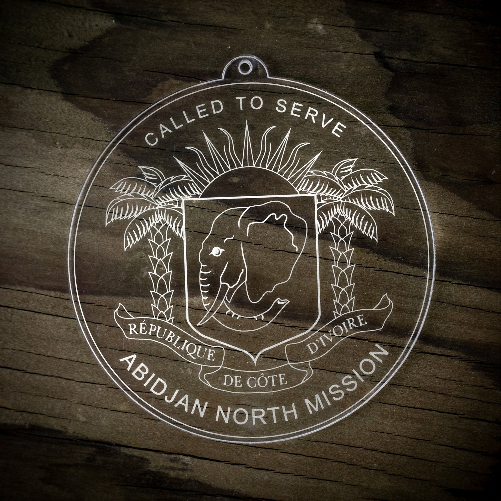 LDS Cote d'Ivoire Abidjan North Mission Christmas Ornament laying on a Wooden Background