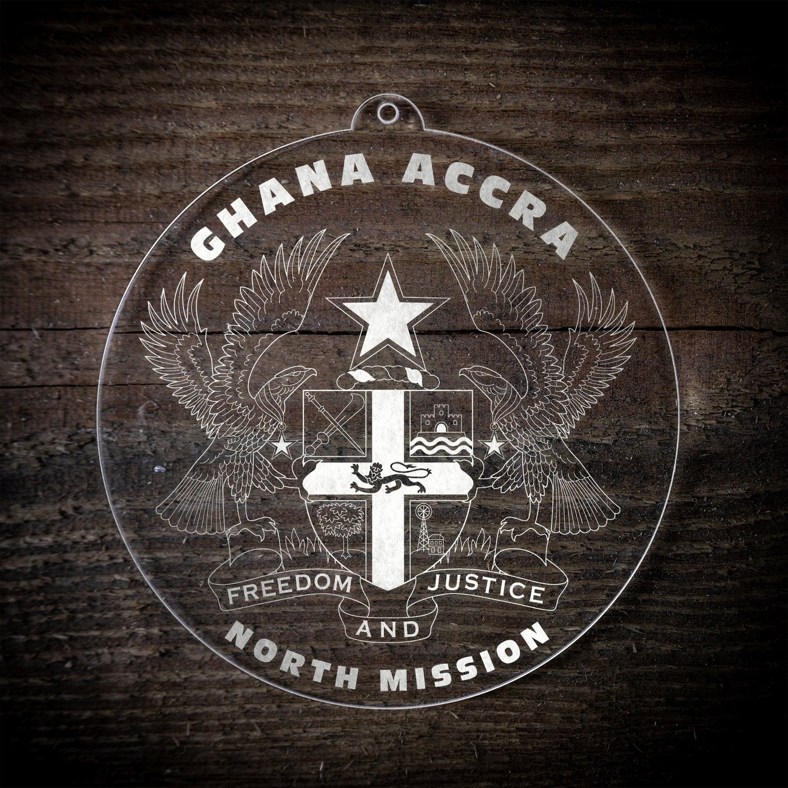 LDS Ghana Accra North Mission Christmas Ornament laying on a Wooden Background