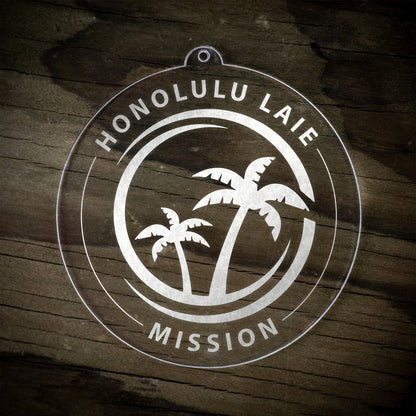 LDS Hawaii Laie Mission Christmas Ornament laying on a Wooden Background