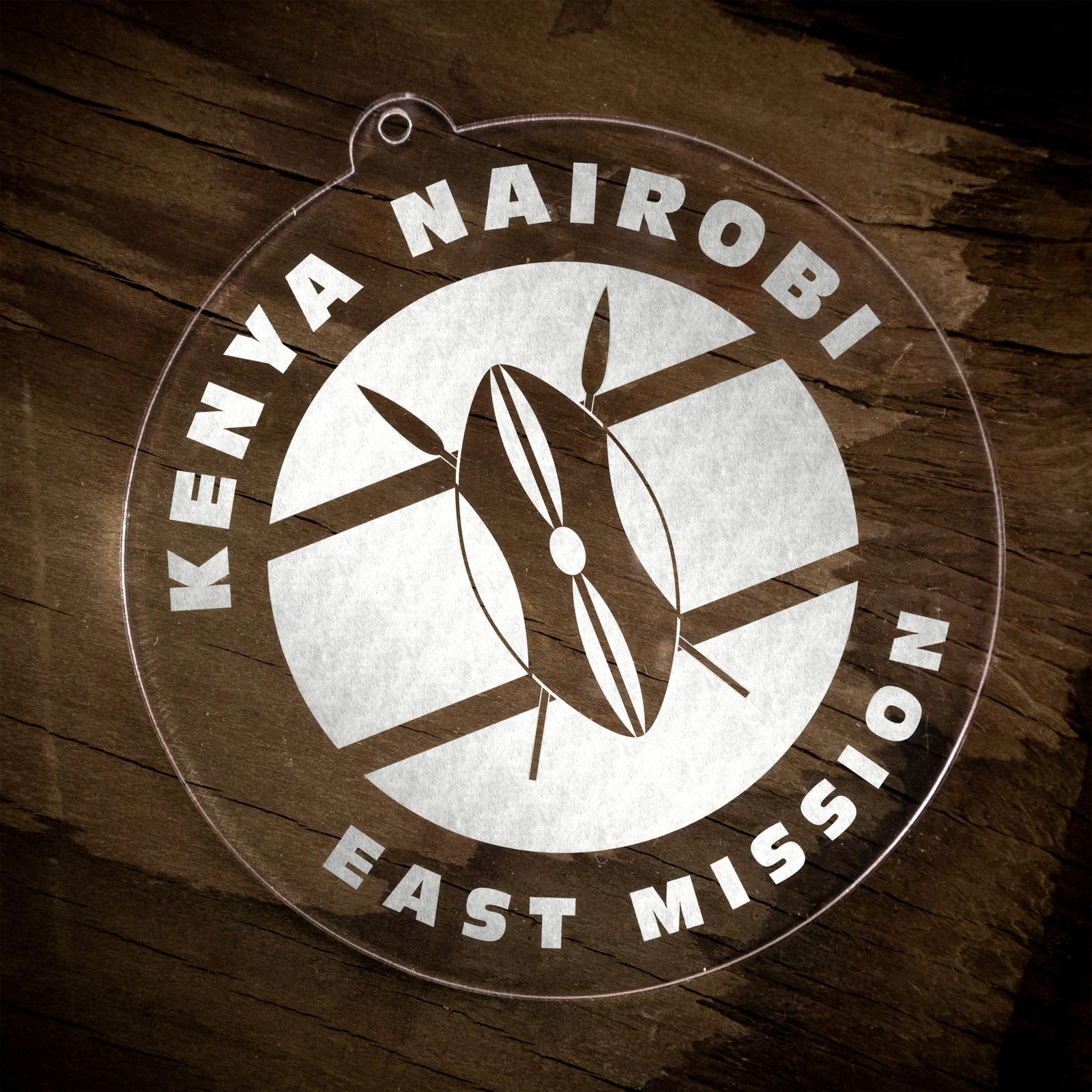 LDS Kenya Nairobi East Mission Christmas Ornament laying on a Wooden Background