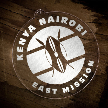 LDS Kenya Nairobi East Mission Christmas Ornament laying on a Wooden Background