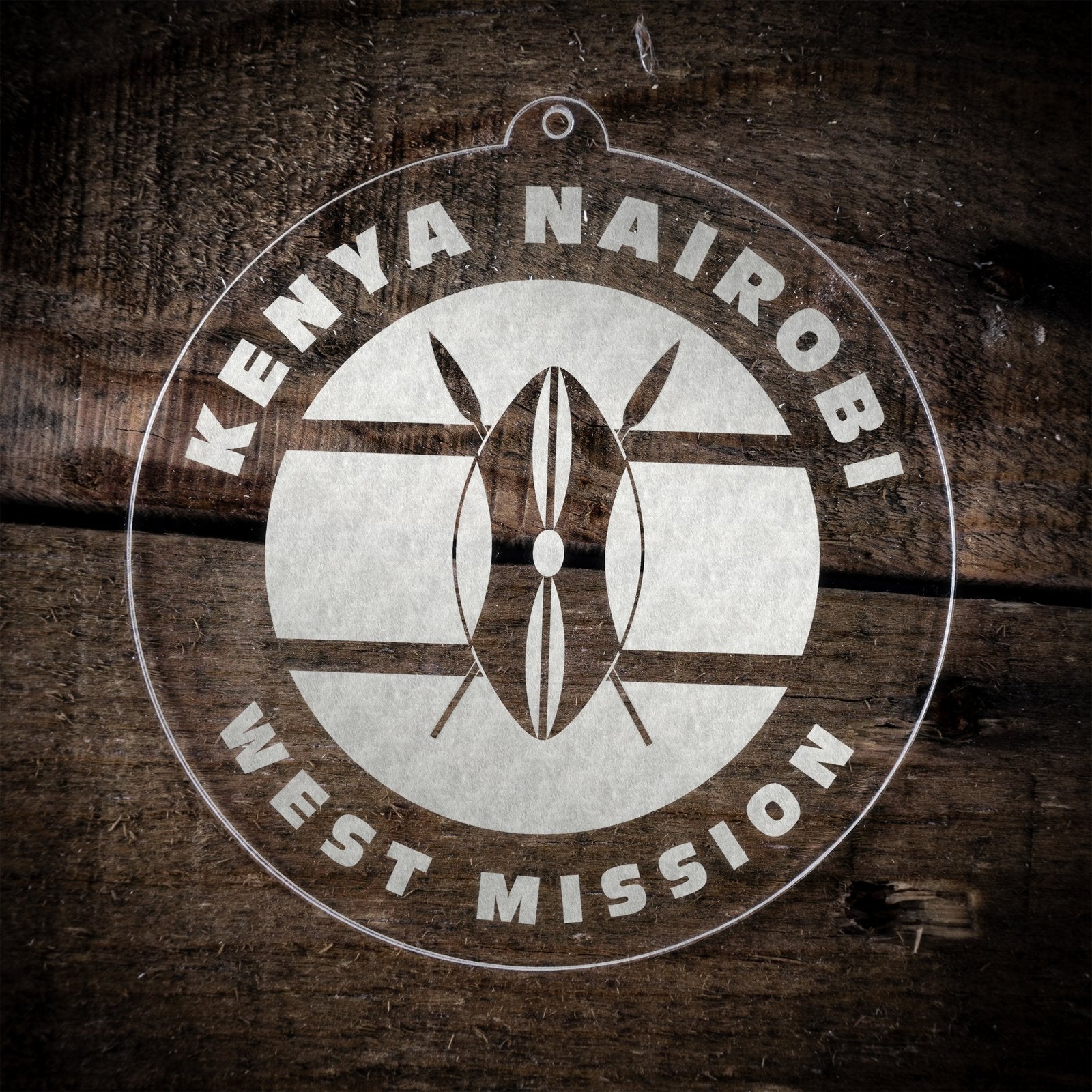 LDS Kenya Nairobi West Mission Christmas Ornament laying on a Wooden Background