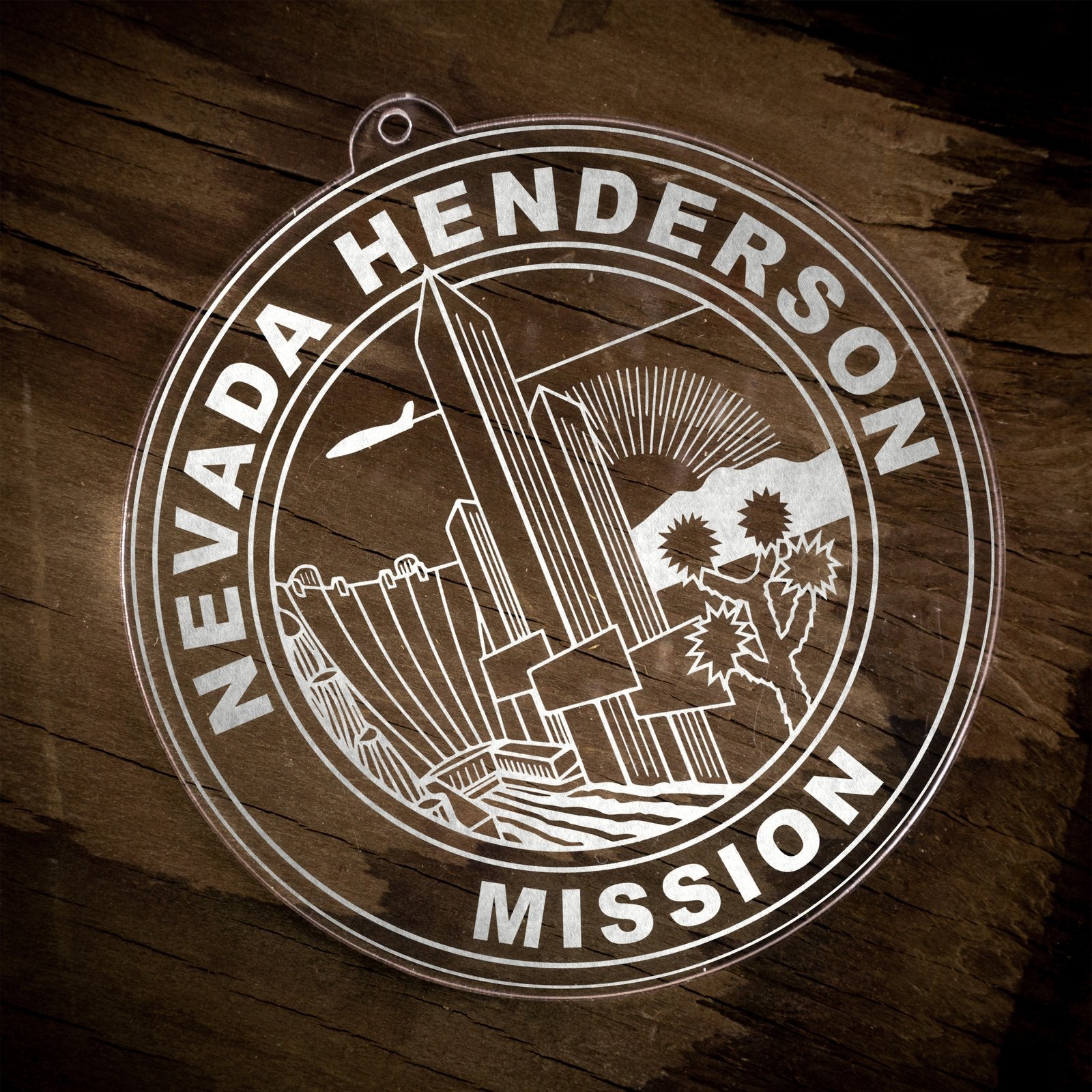LDS Nevada Henderson Mission Christmas Ornament laying on a Wooden Background