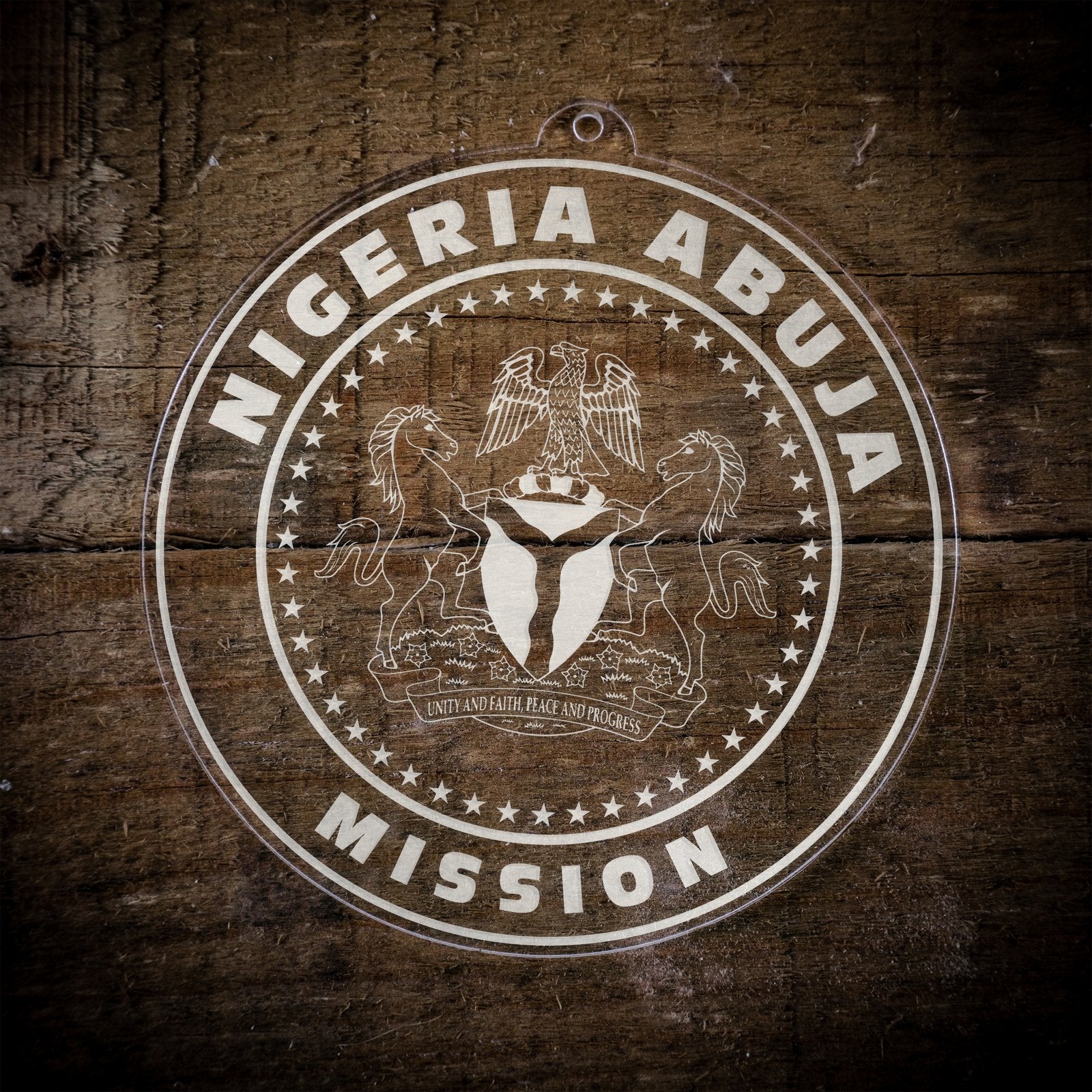 LDS Nigeria Abuja Mission Christmas Ornament laying on a Wooden Background