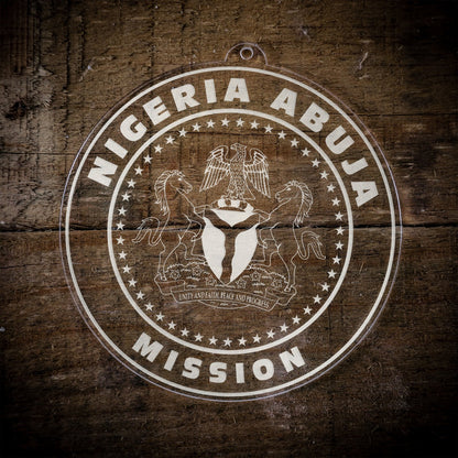 LDS Nigeria Abuja Mission Christmas Ornament laying on a Wooden Background