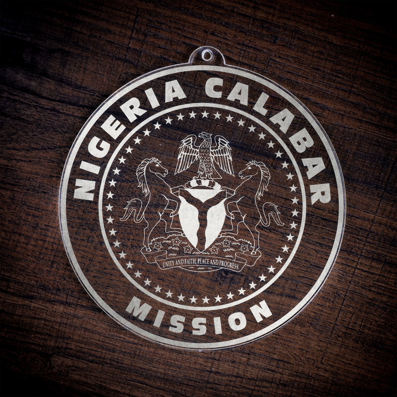 LDS Nigeria Calabar Mission Christmas Ornament laying on a Wooden Background