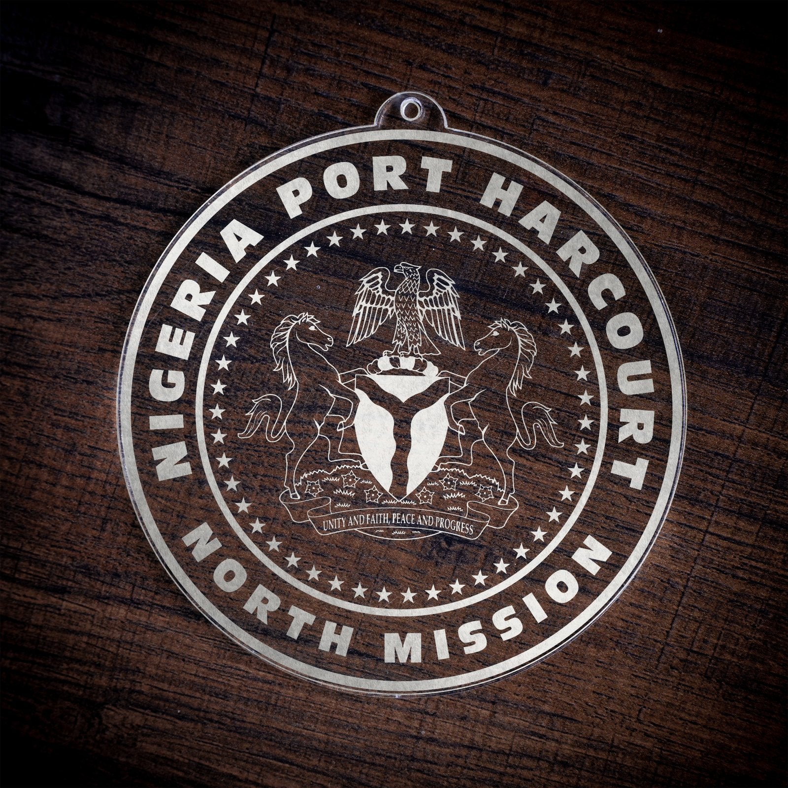 LDS Nigeria Port Harcourt North Mission Christmas Ornament laying on a Wooden Background
