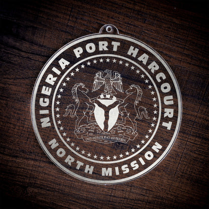 LDS Nigeria Port Harcourt North Mission Christmas Ornament laying on a Wooden Background
