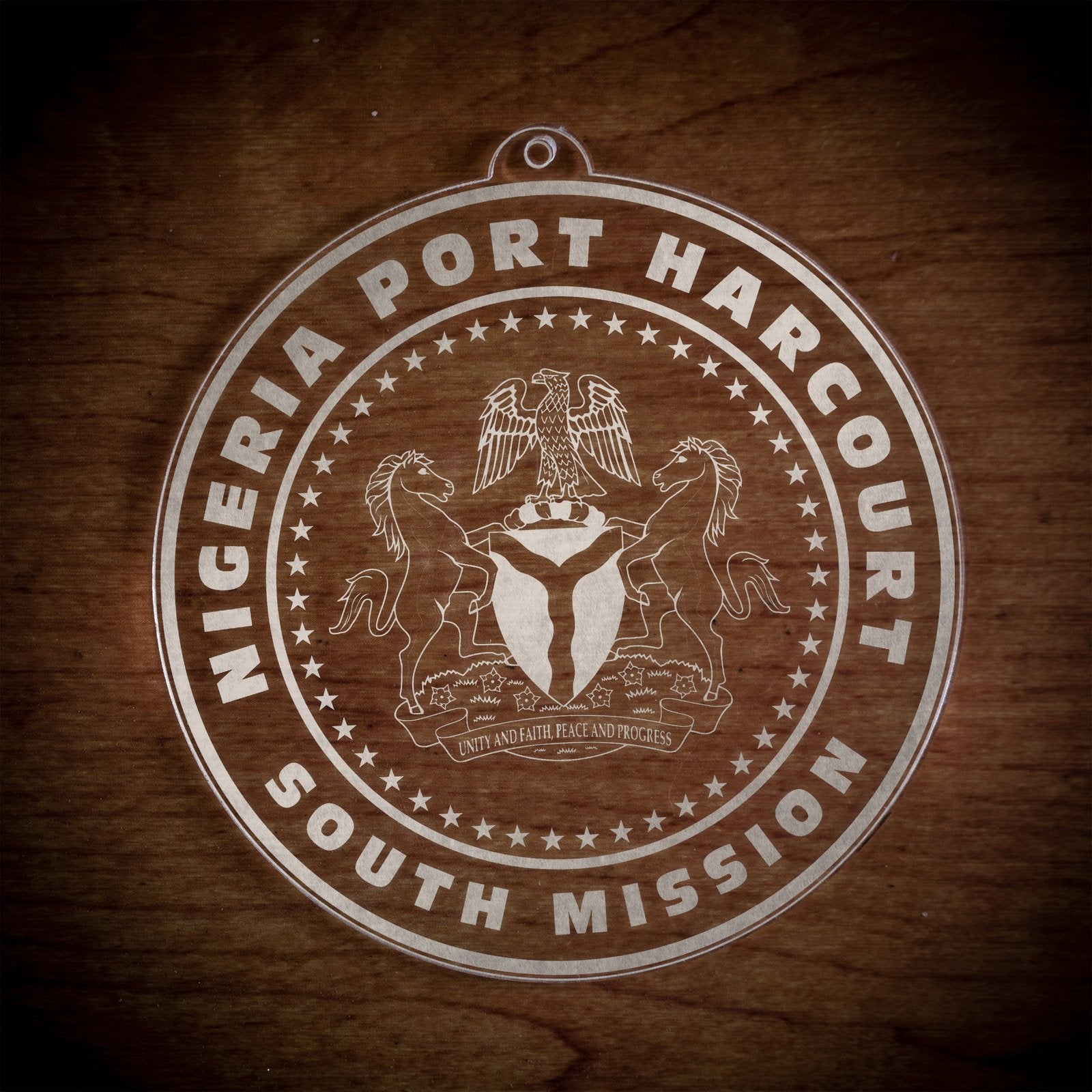 LDS Nigeria Port Harcourt South Mission Christmas Ornament laying on a Wooden Background