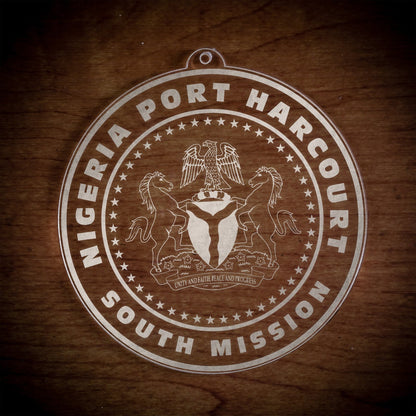 LDS Nigeria Port Harcourt South Mission Christmas Ornament laying on a Wooden Background