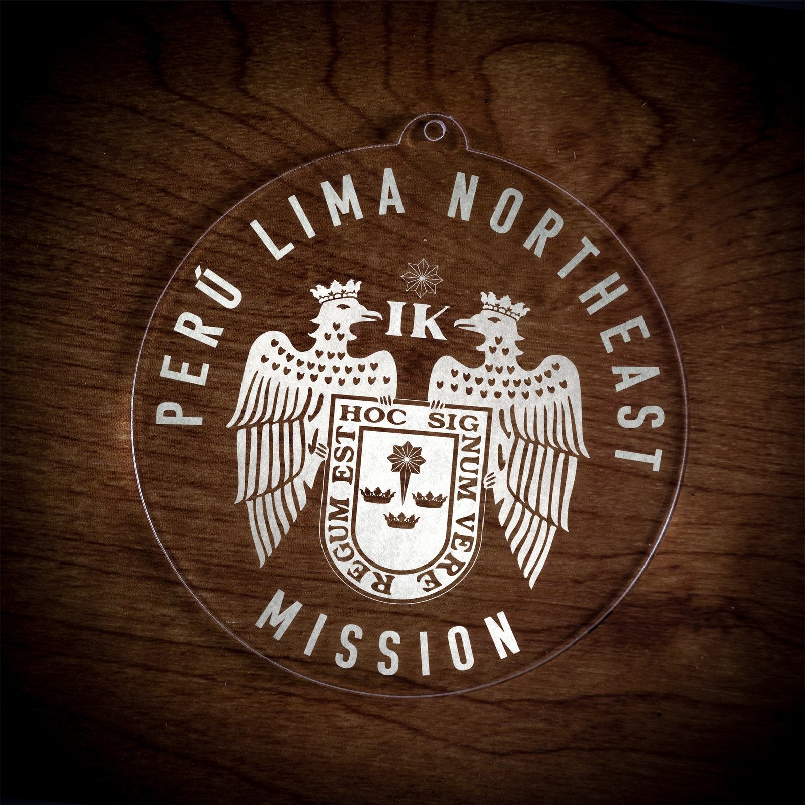 LDS Peru Lima Northeast Mission Christmas Ornament laying on a Wooden Background