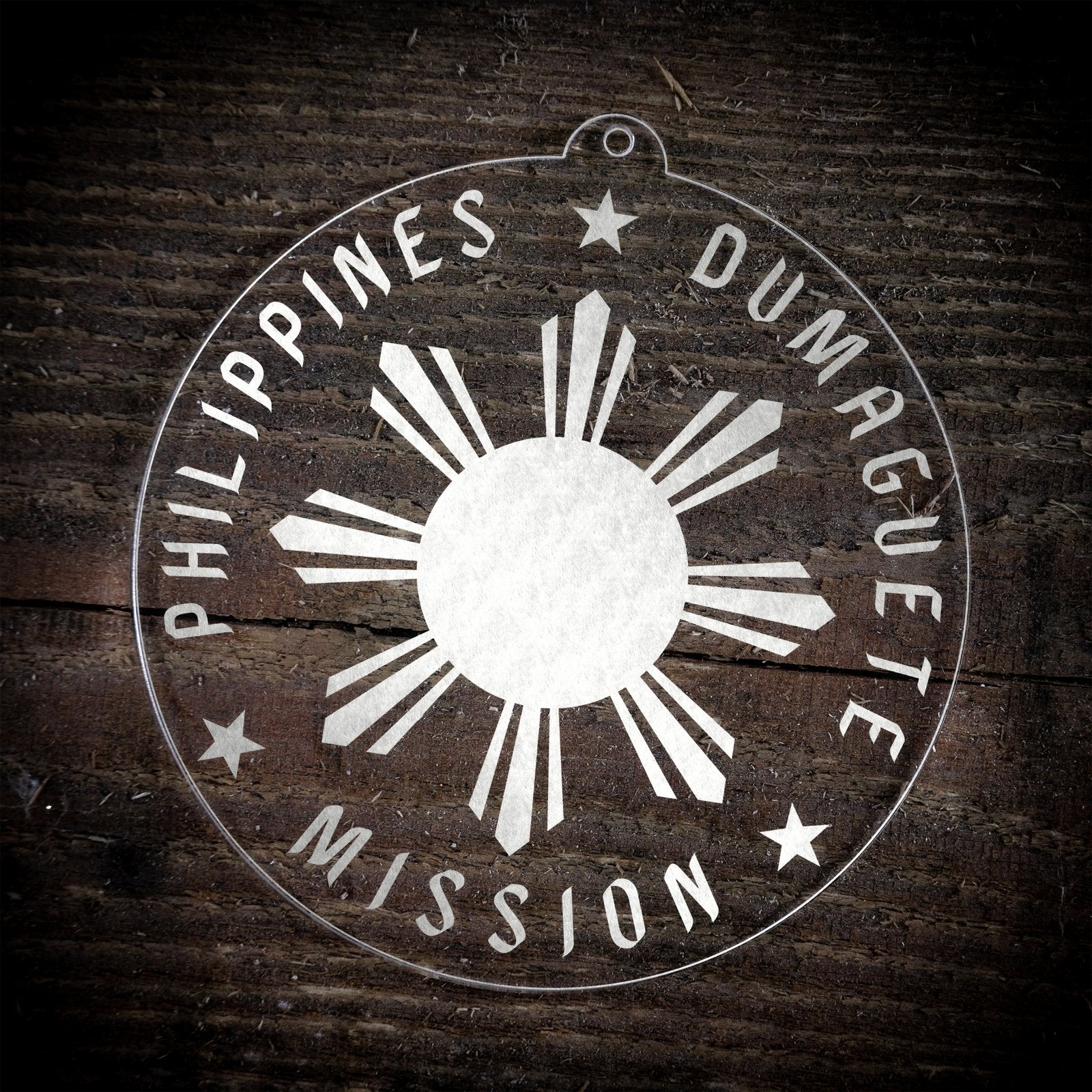 LDS Philippines Dumaguete Mission Christmas Ornament laying on a Wooden Background