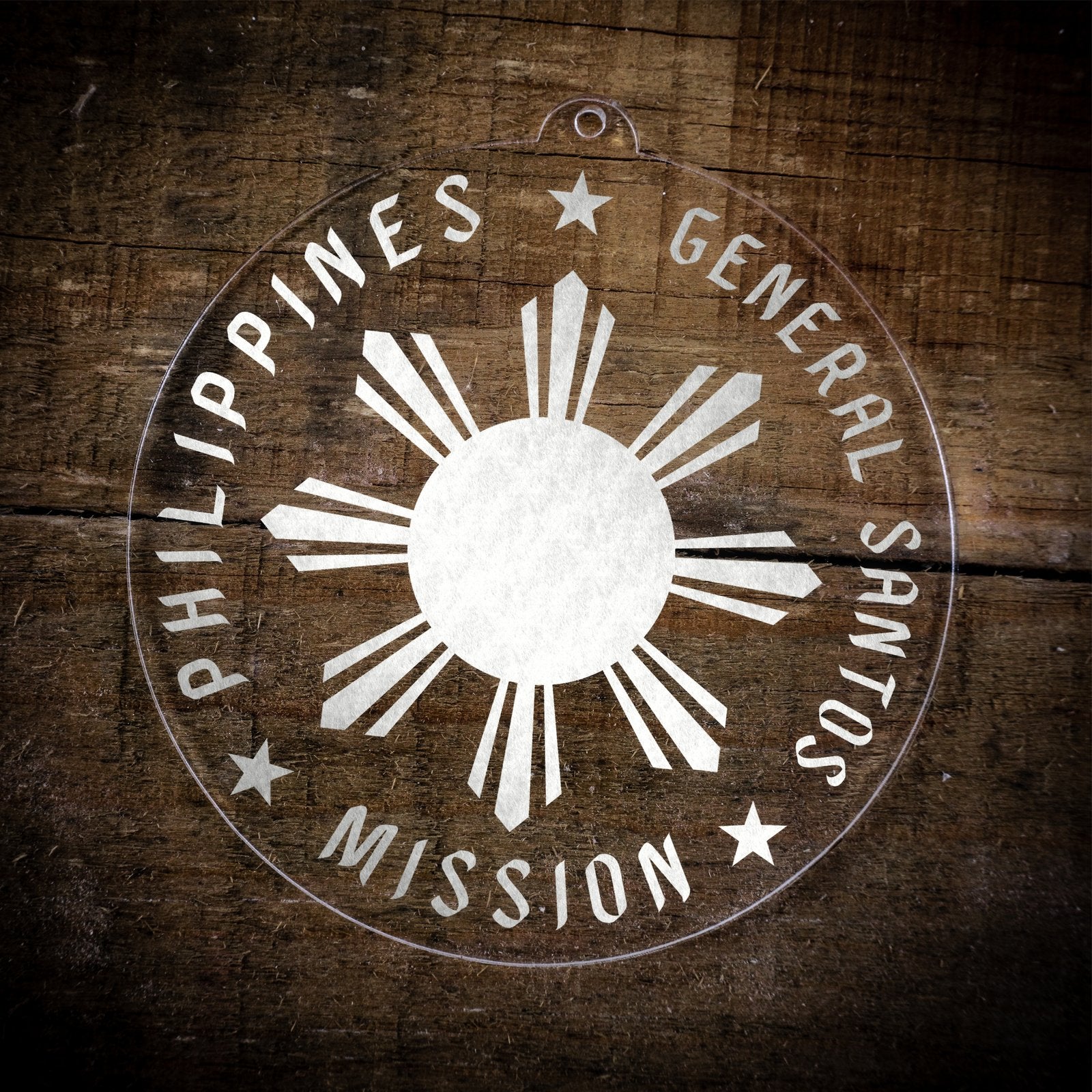 LDS Philippines General Santos Mission Christmas Ornament laying on a Wooden Background