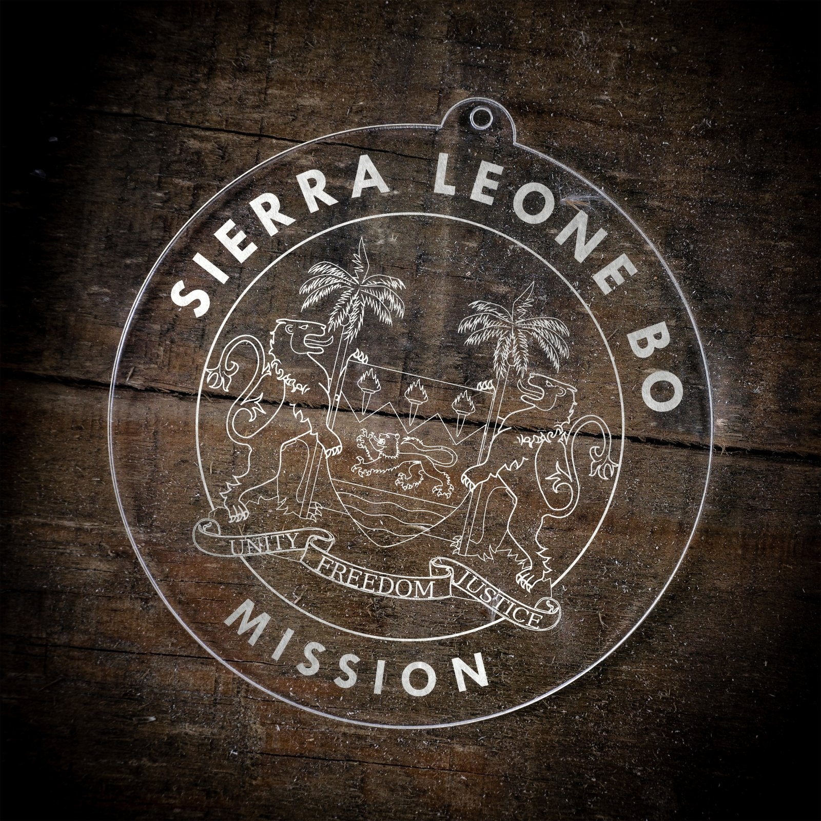 LDS Sierra Leone Bo Mission Christmas Ornament laying on a Wooden Background