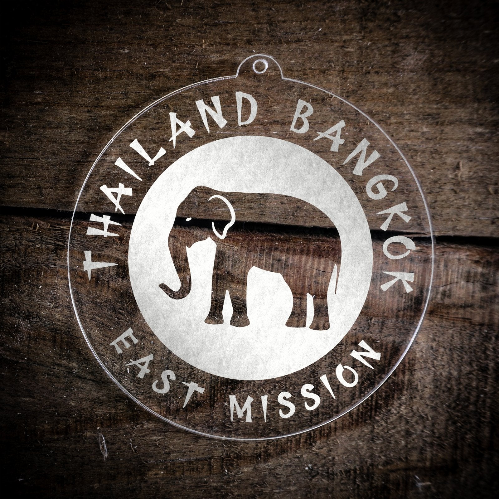 LDS Thailand Bangkok East Mission Christmas Ornament laying on a Wooden Background