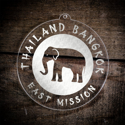 LDS Thailand Bangkok East Mission Christmas Ornament laying on a Wooden Background