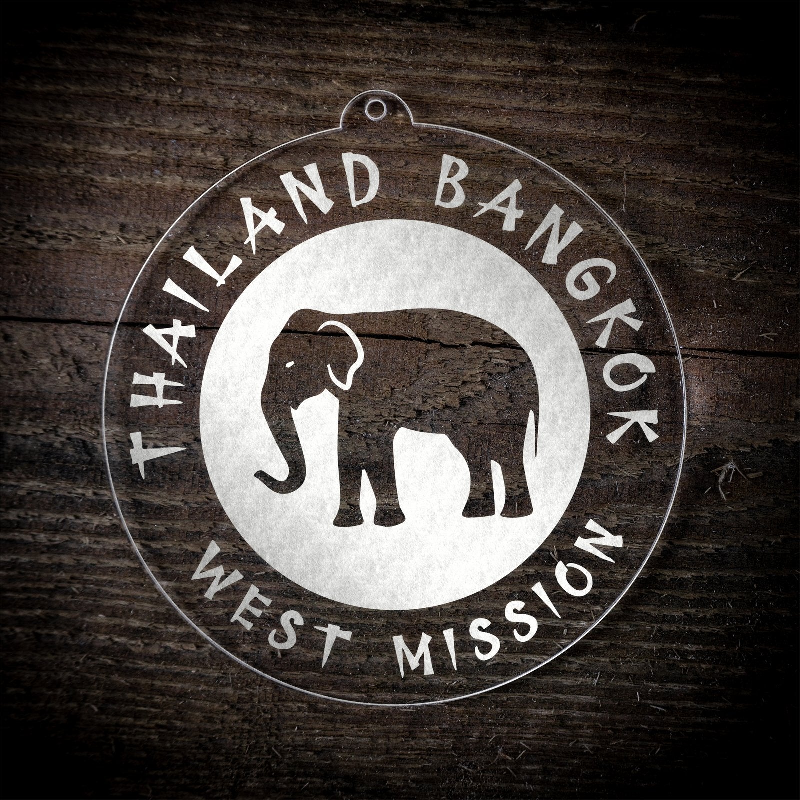 LDS Thailand Bangkok West Mission Christmas Ornament laying on a Wooden Background