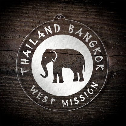 LDS Thailand Bangkok West Mission Christmas Ornament laying on a Wooden Background